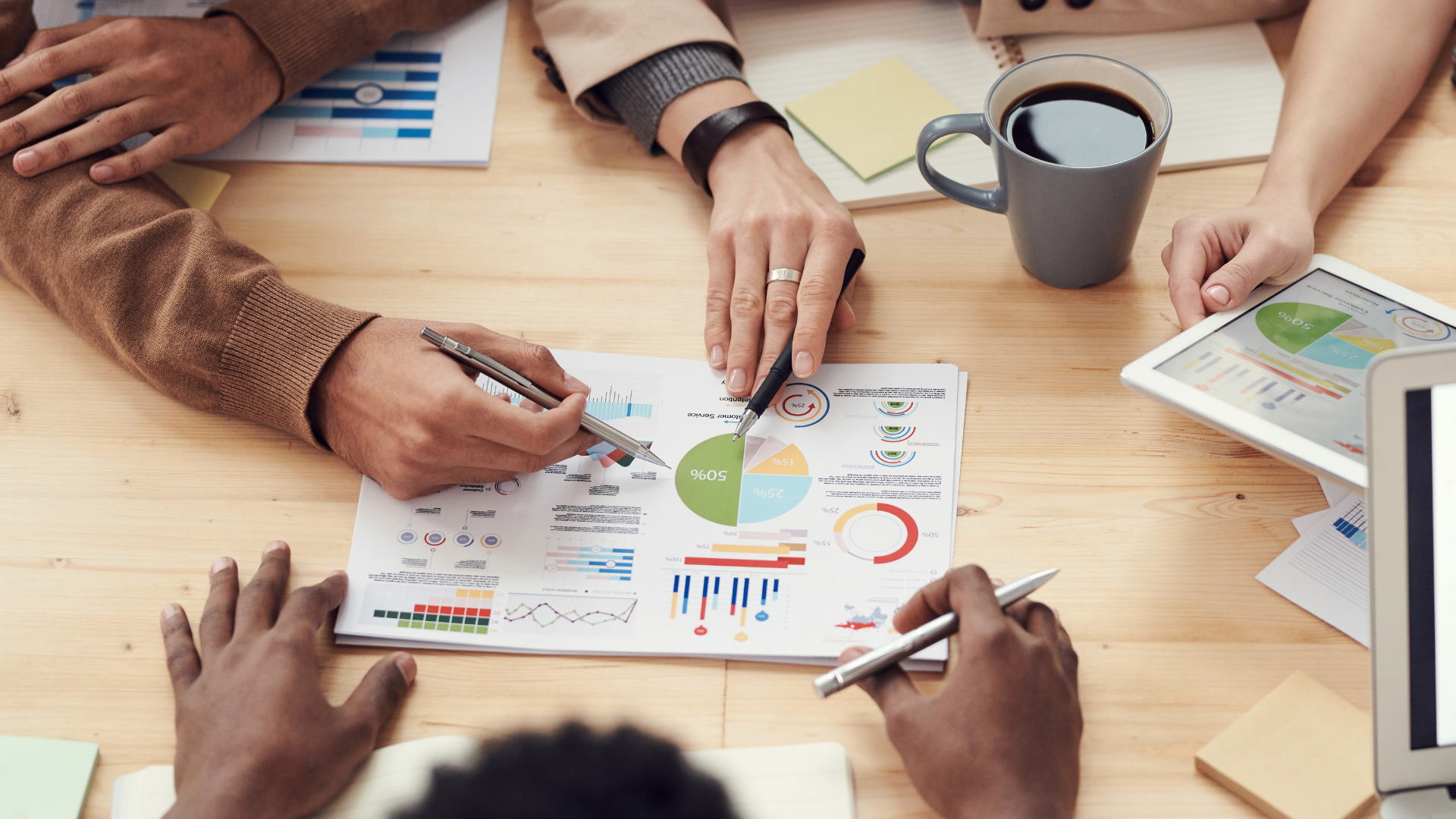 A team reviews some charts