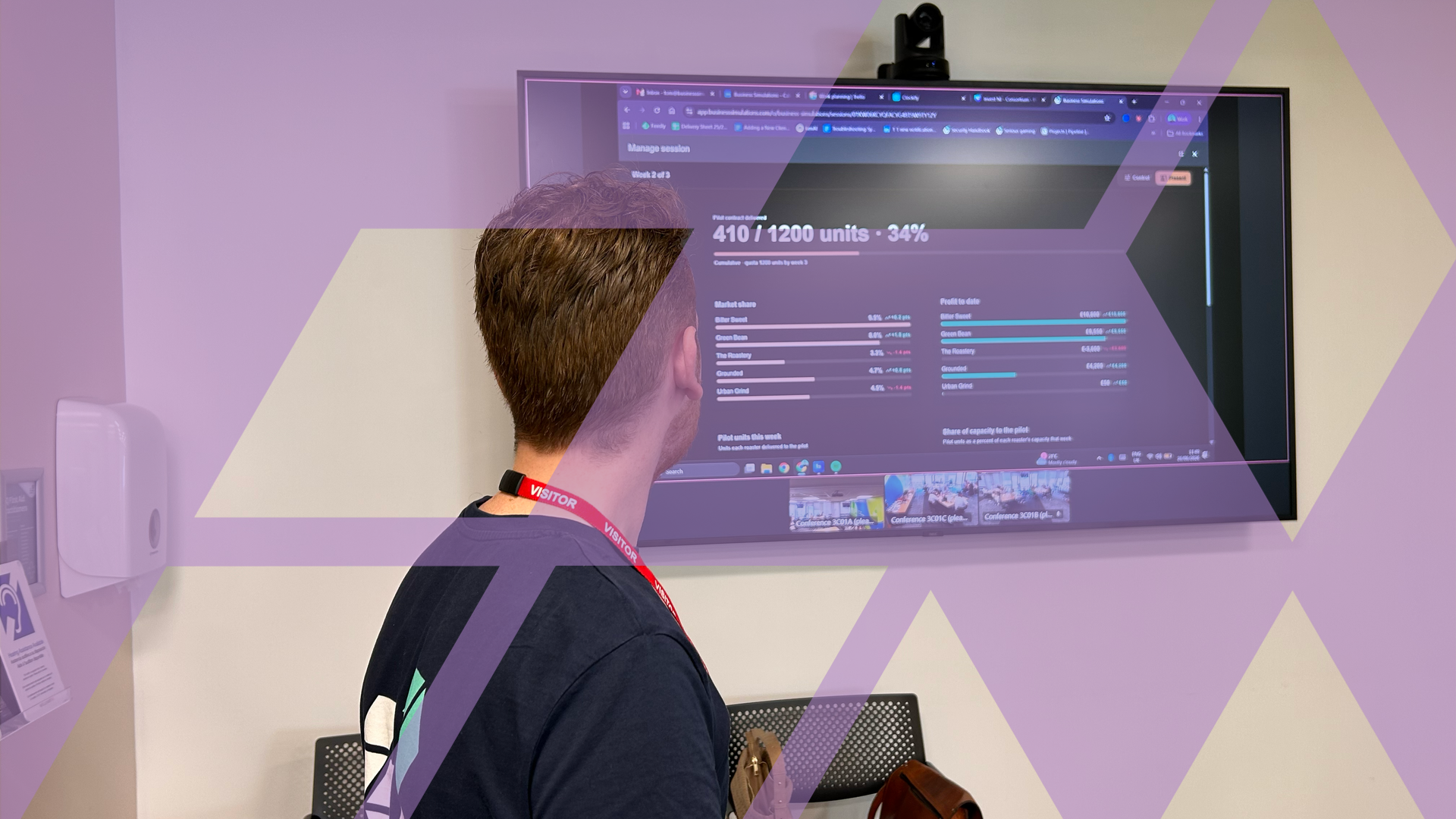 A business simulations employee looking at KPIs on a screen