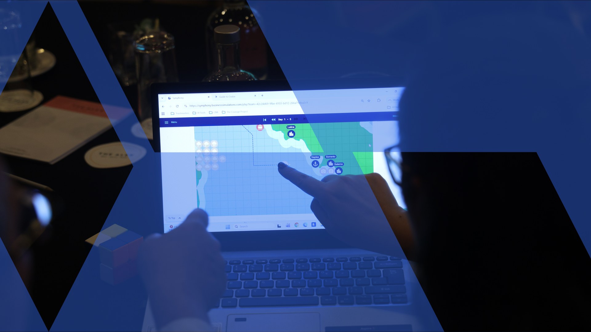A participant scans a strategy map on the simulation platform during a facilitated business simulation, overlaid with the Business Simulations brand motif
